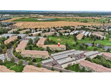 Aerial view of condo building and surrounding golf course at 650 S Alton Way # 5D, Denver, CO 80247
