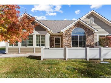 House exterior showcasing a charming ranch style home with a landscaped lawn at 2437 Santa Fe Dr # A, Longmont, CO 80504