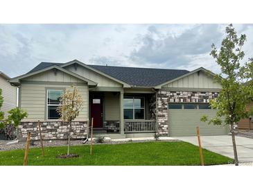 Single-story house with stone accents and a two-car garage at 1817 Sawtooth Mountain Dr, Berthoud, CO 80513