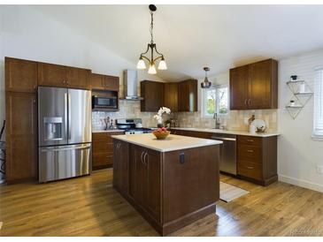 Modern kitchen with stainless steel appliances and an island at 5971 Windy St, Golden, CO 80403