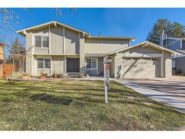 Two-story house with attached garage and well-maintained lawn at 3624 S Ivory Ct, Aurora, CO 80013