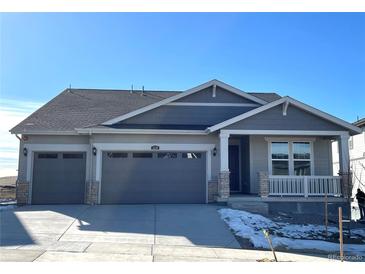 Charming two-story home with a two-car garage and covered porch at 1278 Raindance Pl, Erie, CO 80516