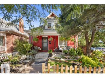 Charming red house with a landscaped front yard at 403 W 3Rd Ave, Denver, CO 80223