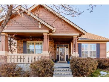 Craftsman style home with front porch and landscaping at 12955 Vallejo Cir, Westminster, CO 80234