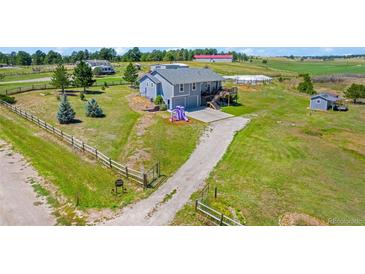 Aerial view of house, yard, and outbuildings at 36023 Winchester Rd, Elizabeth, CO 80107