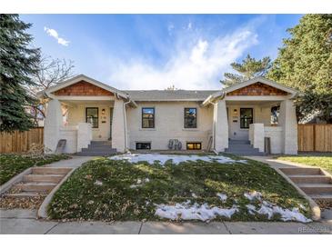 Newly renovated duplex with charming front porches and landscaped yards at 1151 S Grant St, Denver, CO 80210