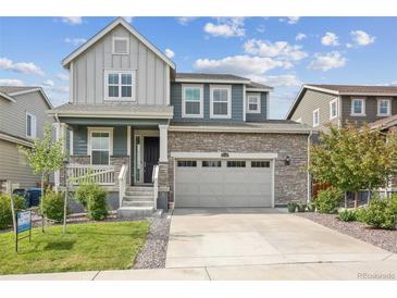 Two-story house with a gray and teal exterior at 26346 E Canal Pl, Aurora, CO 80018
