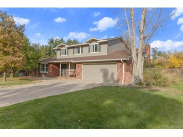 Two-story brick home with a large yard at 3872 S Xanthia St, Denver, CO 80237