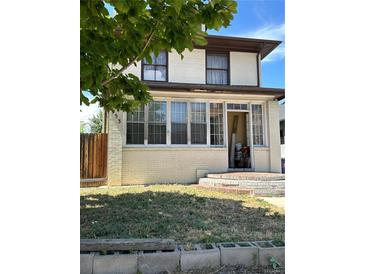 Two-story home with a classic design and a front porch at 1053 N Colorado Blvd, Denver, CO 80206