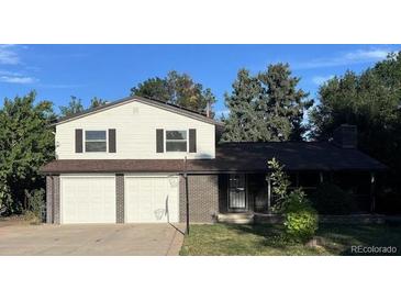 Two-story home with a two-car attached garage at 3006 S Fenton St, Denver, CO 80227