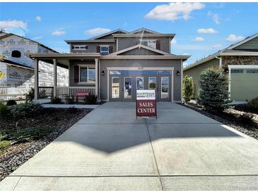 Two-story home with attached garage and landscaping at 2171 Peralta Loop, Castle Rock, CO 80104