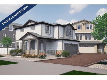 Two-story house with white siding, gray trim, and a two-car garage at 1213 Sugarloaf Ln, Erie, CO 80516