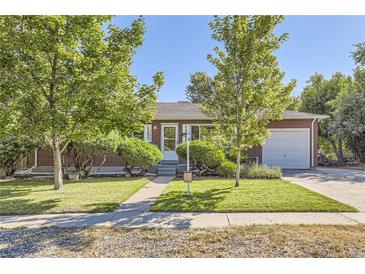 Brick ranch home with a well-maintained lawn at 752 S Union Blvd, Lakewood, CO 80228