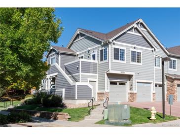 Two-story townhome with attached garage and landscaping at 14300 Waterside Ln # L5, Broomfield, CO 80023