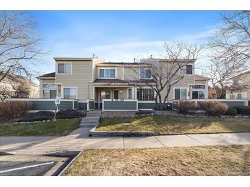 Attractive exterior of a townhome with landscaping and a walkway at 930 Button Rock Dr # J59, Longmont, CO 80504