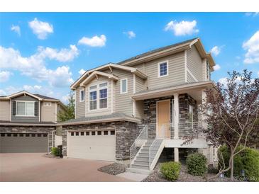 Two-story house with stone and siding exterior at 8095 E 128Th Pl, Thornton, CO 80602