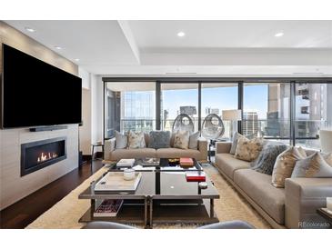 Spacious living room with floor-to-ceiling windows and city views at 1133 14Th St # 2620, Denver, CO 80202