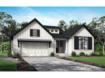 Stunning craftsman style home with a three car garage and well-maintained lawn at 1838 Hickory Ave, Erie, CO 80516