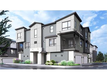 Modern three-story townhome with attached garage at 11940 Soprano Trl, Lone Tree, CO 80134