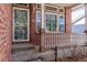 Front door with decorative glass and storm door at 13661 Adams St, Thornton, CO 80602