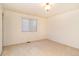 Bright bedroom featuring a large window and neutral decor at 13661 Adams St, Thornton, CO 80602