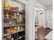 Well-organized pantry with ample shelving for storage at 11766 S Breeze Grass Way, Parker, CO 80134