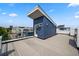 Spacious rooftop deck with built-in fireplace and city views at 3425 W 16Th Ave, Denver, CO 80204