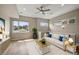Bright and airy living room with hardwood floors and ceiling fan at 3425 W 16Th Ave, Denver, CO 80204