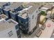 Aerial view of modern townhouses with private decks and city views at 3425 W 16Th Ave, Denver, CO 80204