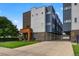 Modern three-story townhome with attached garage and well-maintained landscaping at 3425 W 16Th Ave, Denver, CO 80204