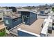 Aerial view of modern townhouses with private decks and city views at 3425 W 16Th Ave, Denver, CO 80204