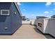 Spacious rooftop deck with built-in fireplace and city views at 3425 W 16Th Ave, Denver, CO 80204