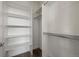 Large walk-in closet with built-in shelves and hanging rods at 3425 W 16Th Ave, Denver, CO 80204