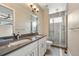 Main bathroom with double vanity and a shower at 3425 W 16Th Ave, Denver, CO 80204