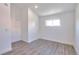 Simple bedroom with grey flooring and a window at 991 E 88Th Ave, Thornton, CO 80229