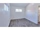 Bright bedroom with gray vinyl flooring and window at 991 E 88Th Ave, Thornton, CO 80229