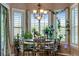 Charming breakfast nook with a round table and views from many windows at 10364 Carriage Club Dr, Lone Tree, CO 80124