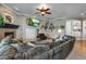 Comfortable living room with a fireplace and built-in entertainment center at 10364 Carriage Club Dr, Lone Tree, CO 80124