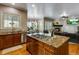 Spacious kitchen with island, granite countertops, and stainless steel appliances at 10364 Carriage Club Dr, Lone Tree, CO 80124