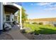 Landscaped backyard with a spacious lawn and patio area at 10364 Carriage Club Dr, Lone Tree, CO 80124