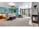 Spacious main bedroom with fireplace and sitting area at 10364 Carriage Club Dr, Lone Tree, CO 80124