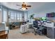 Home office with built-in workspace and large windows at 10364 Carriage Club Dr, Lone Tree, CO 80124
