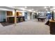 Basement bar with granite countertop and wood cabinetry at 10364 Carriage Club Dr, Lone Tree, CO 80124