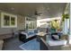 Spacious covered patio with hot tub and comfortable seating area at 10364 Carriage Club Dr, Lone Tree, CO 80124