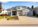 Two-story home with three car garage and landscaped yard at 10364 Carriage Club Dr, Lone Tree, CO 80124
