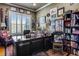 Functional home office with built-in shelving and large desk at 10364 Carriage Club Dr, Lone Tree, CO 80124