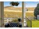 Enjoy the view from this covered patio with comfortable seating at 10364 Carriage Club Dr, Lone Tree, CO 80124