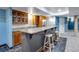 Well-equipped basement wet bar with granite counters at 10364 Carriage Club Dr, Lone Tree, CO 80124