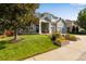 Two-story home with landscaped yard and large driveway at 10364 Carriage Club Dr, Lone Tree, CO 80124