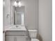 Clean bathroom with single sink vanity and toilet at 1815 Chaffee Crest Dr, Berthoud, CO 80513
